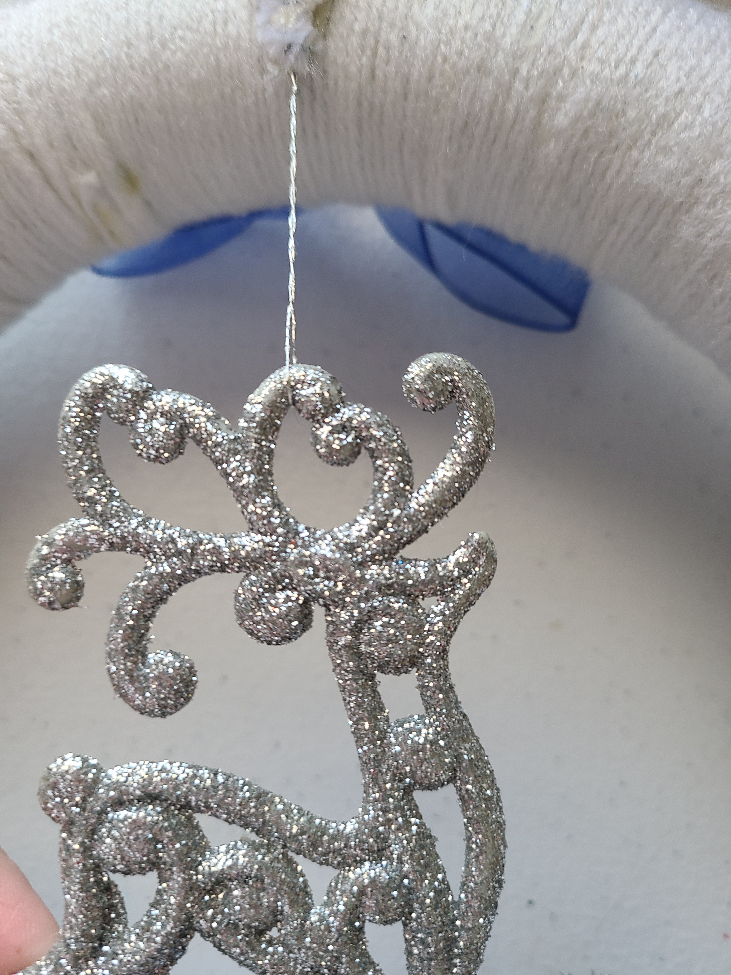Silver glitter reindeer adorning DIY Christmas decorations.
