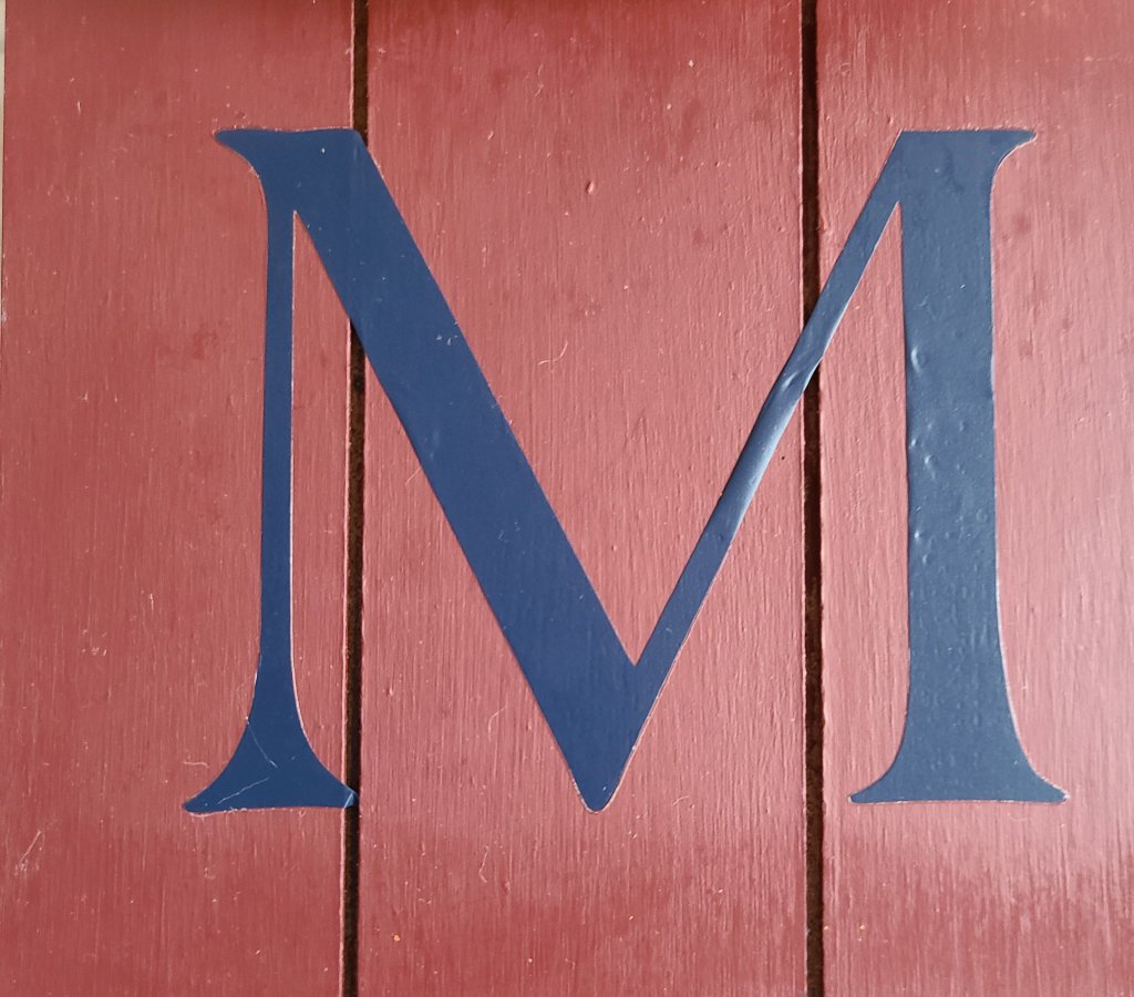 HTV navy letter M on the fall home sign painted burgundy.