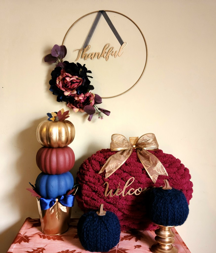 Braided yarn pumpkins with a pumpkin topiary, fall hoop wreath, and woven pumpkin wreath.
