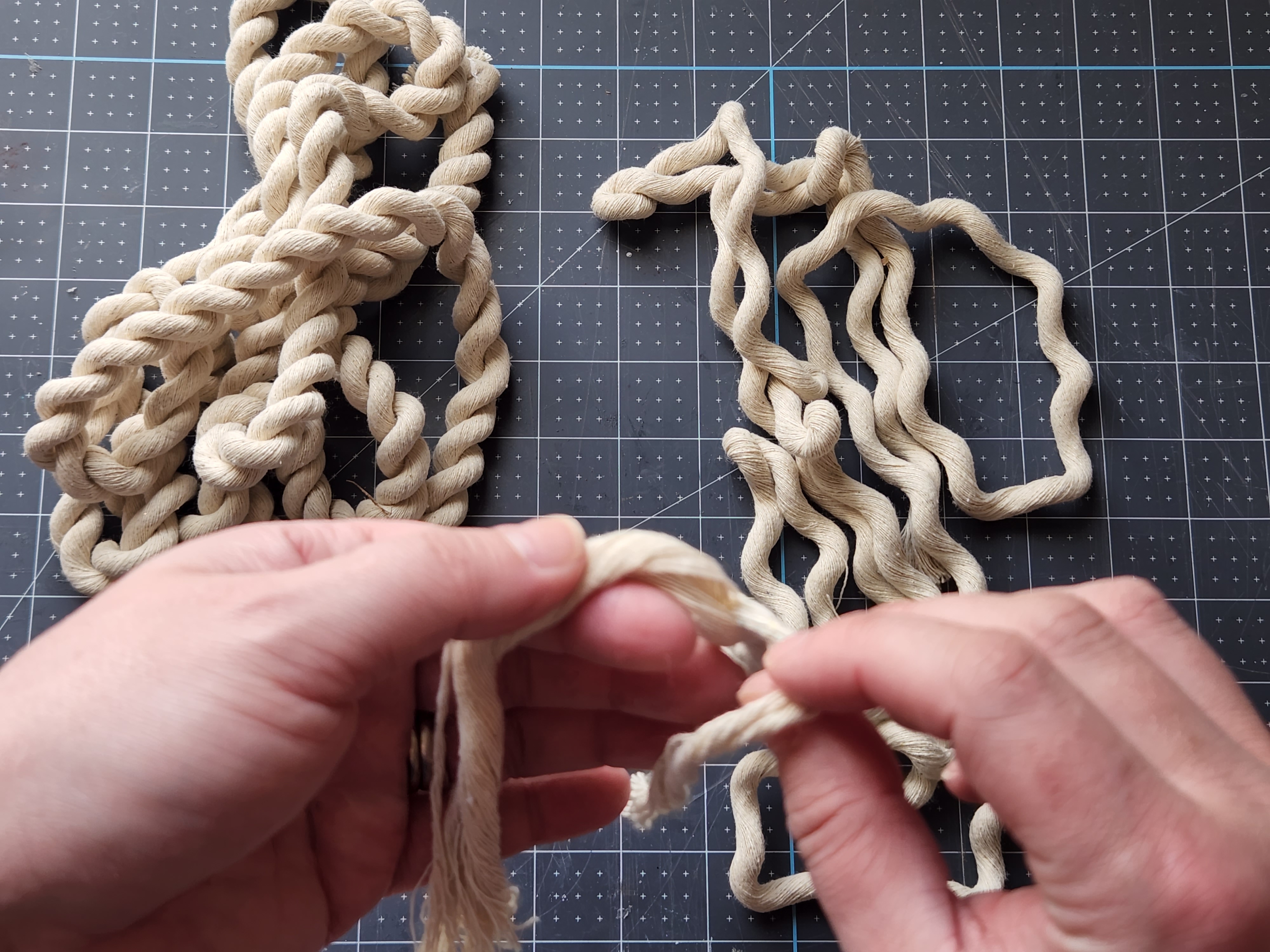 Unraveling one of the three strands from the rope to use on the wreath.