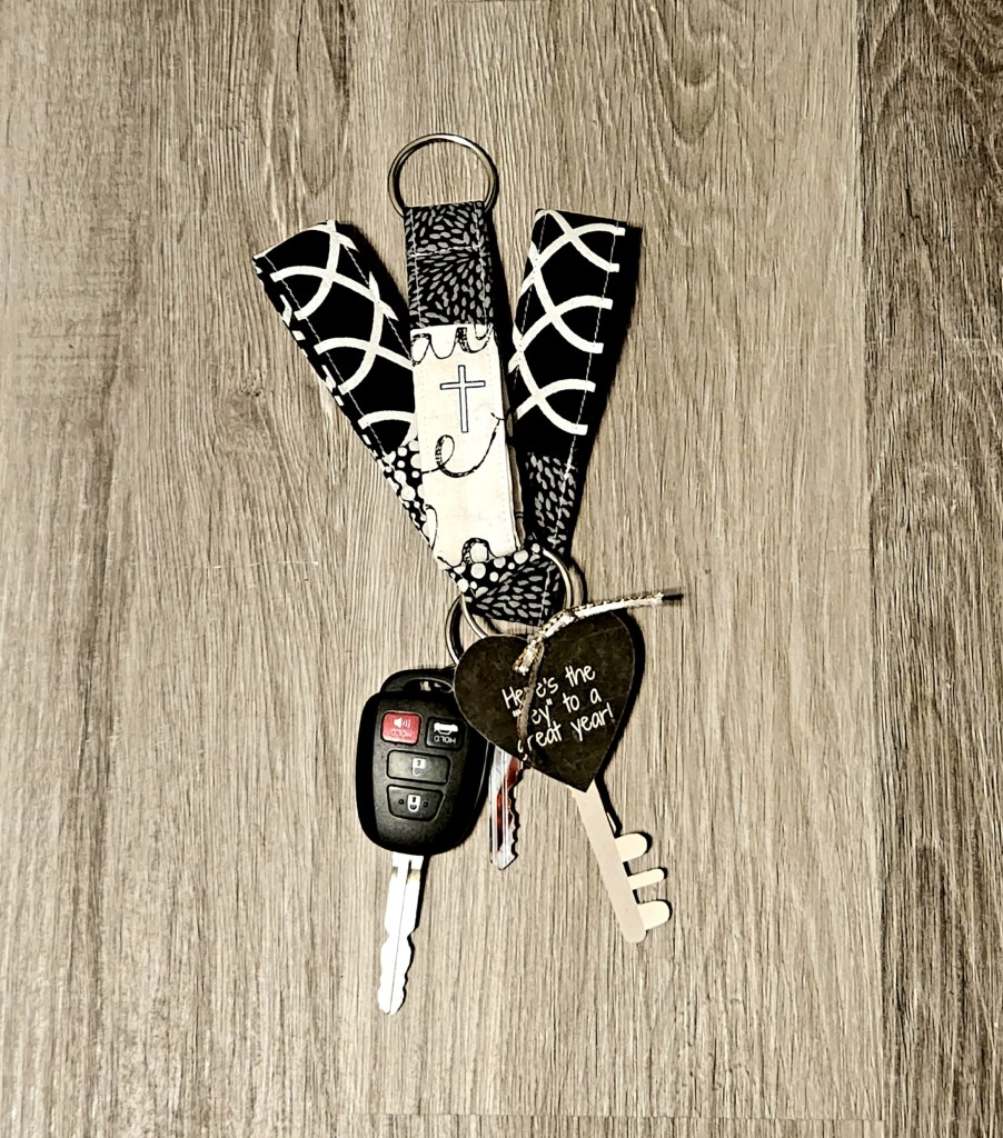 Three fabric key fob keychains in various black and white fabric combos