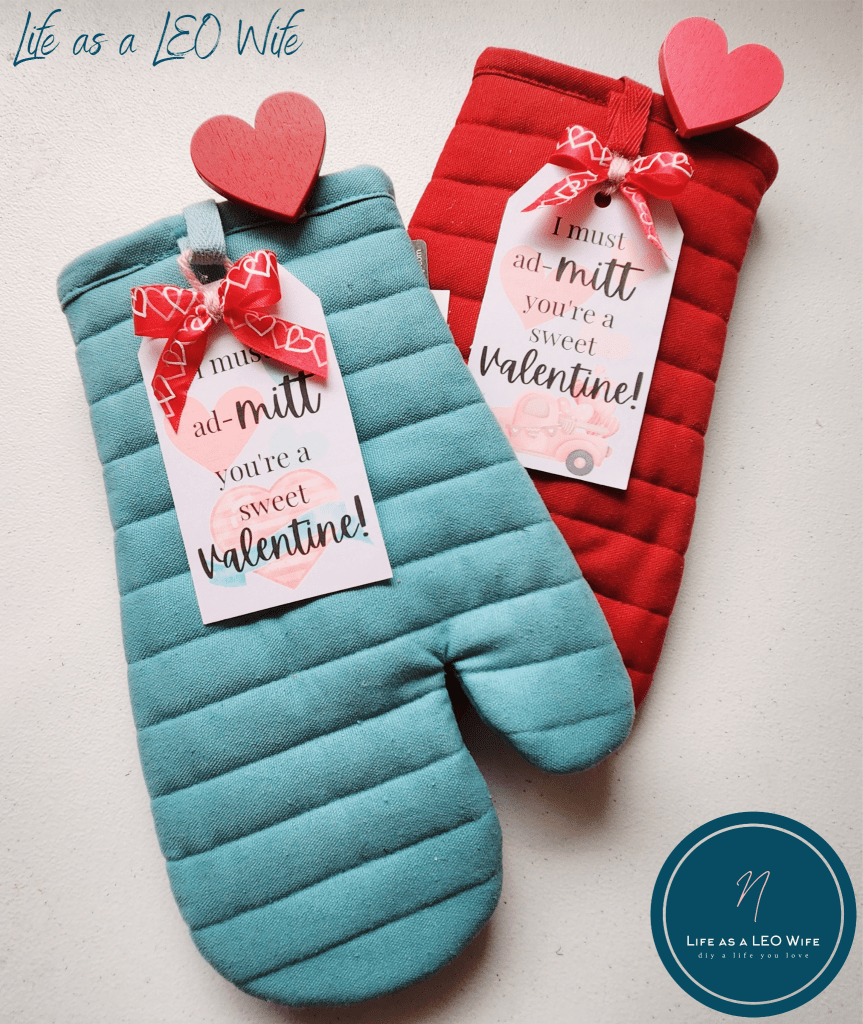 Last minute Valentine's gift for my son's teachers; a blue oven mitt and a red oven mitt with gift tags that say, "I must ad-mitt you're a sweet Valentine!"