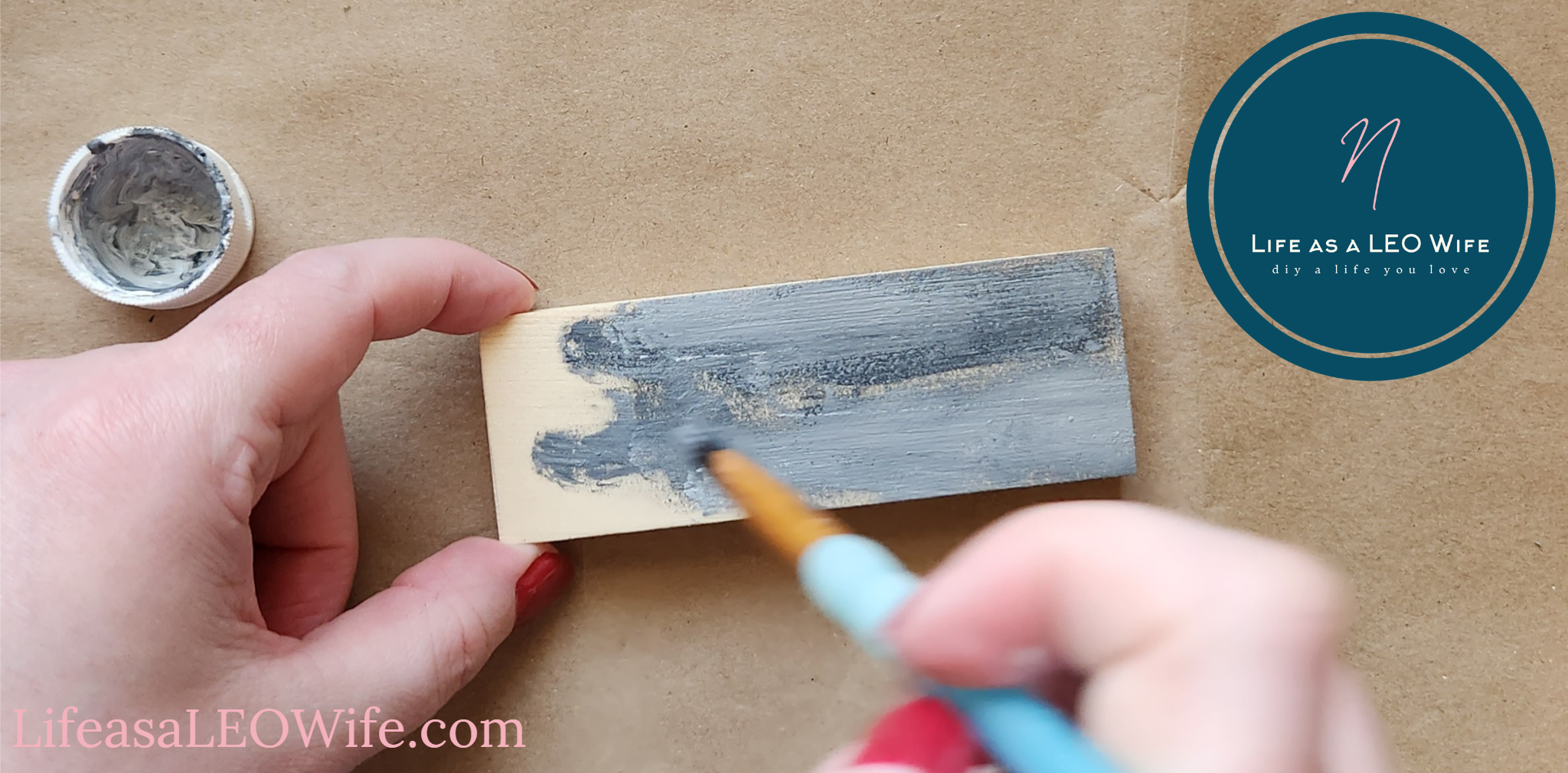 Painting the place card holder with gray chalk paint.