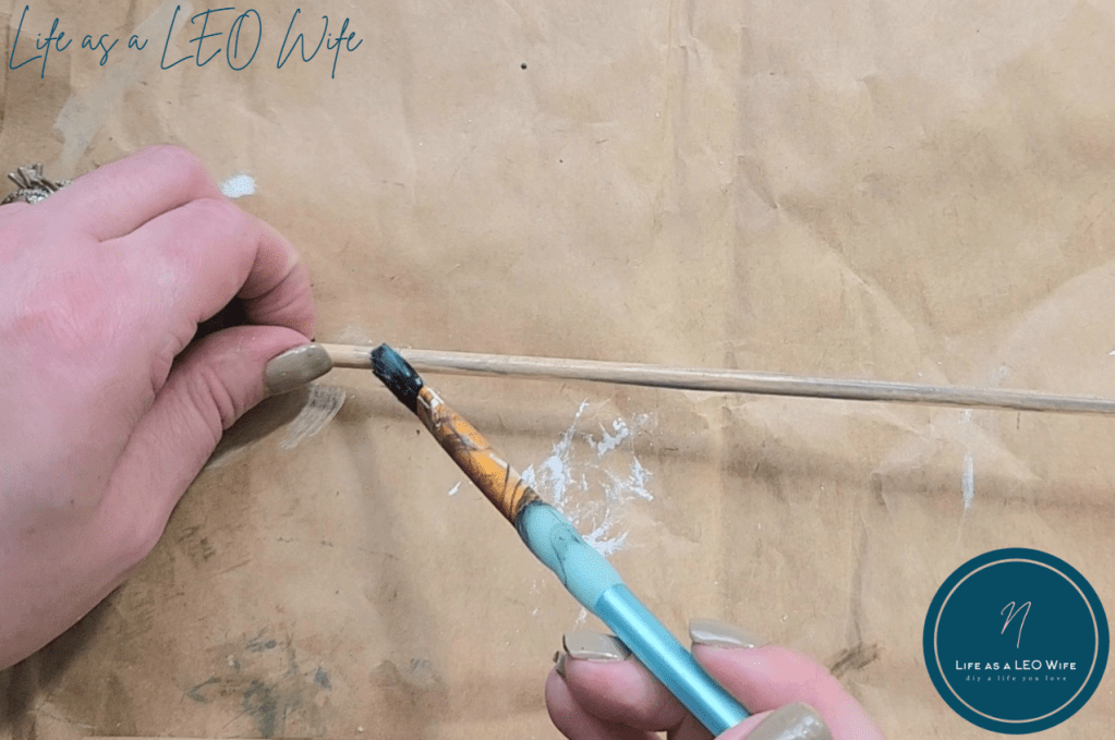 Staining a wood dowel with weathered gray stain.