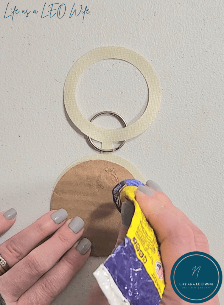 Squeezing Quick Grip on a cardboard circle.