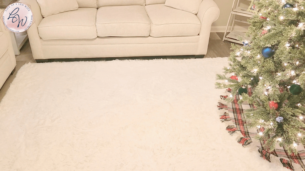 A white rug under the Christmas tree skirt & tree & under where the coffee table will go.