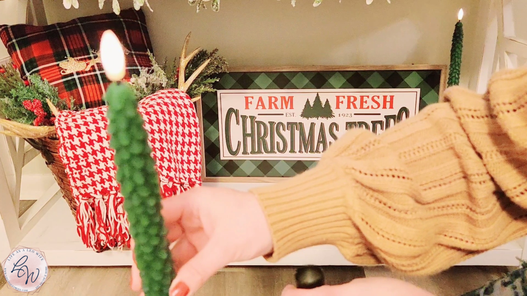 Faux tapered candle shaped like a Christmas tree.