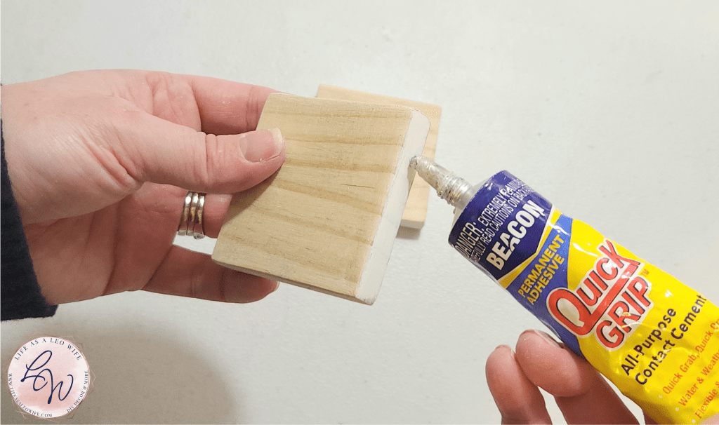 Adding Quick Grip to the edge of a wood block to create the base of the shelf sitter.