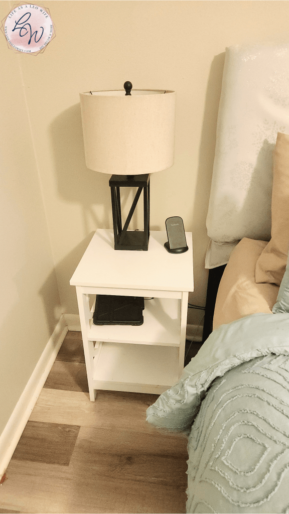 White nightstand replacing a larger black one.