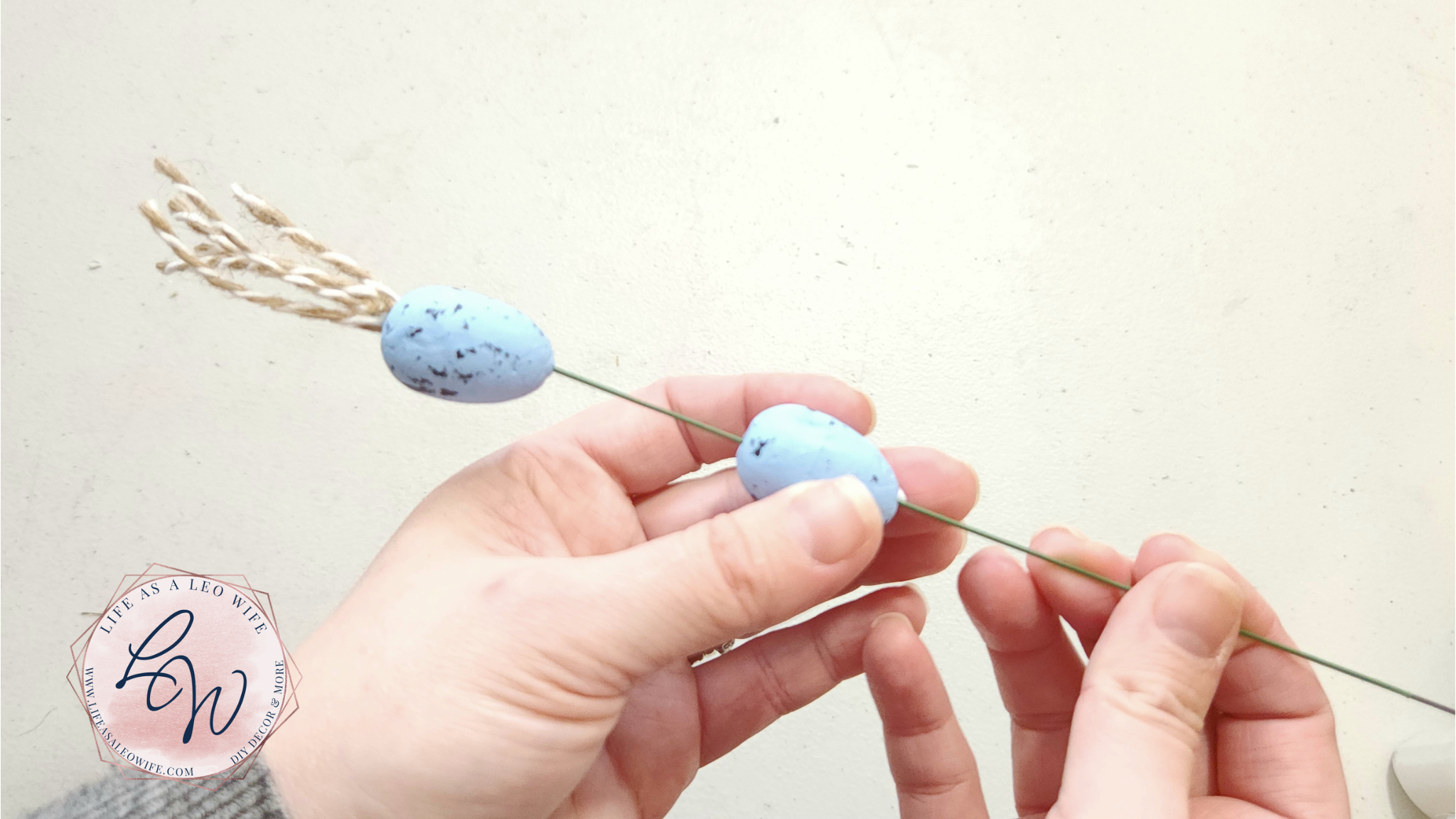 Sliding the 2nd egg onto the wire.