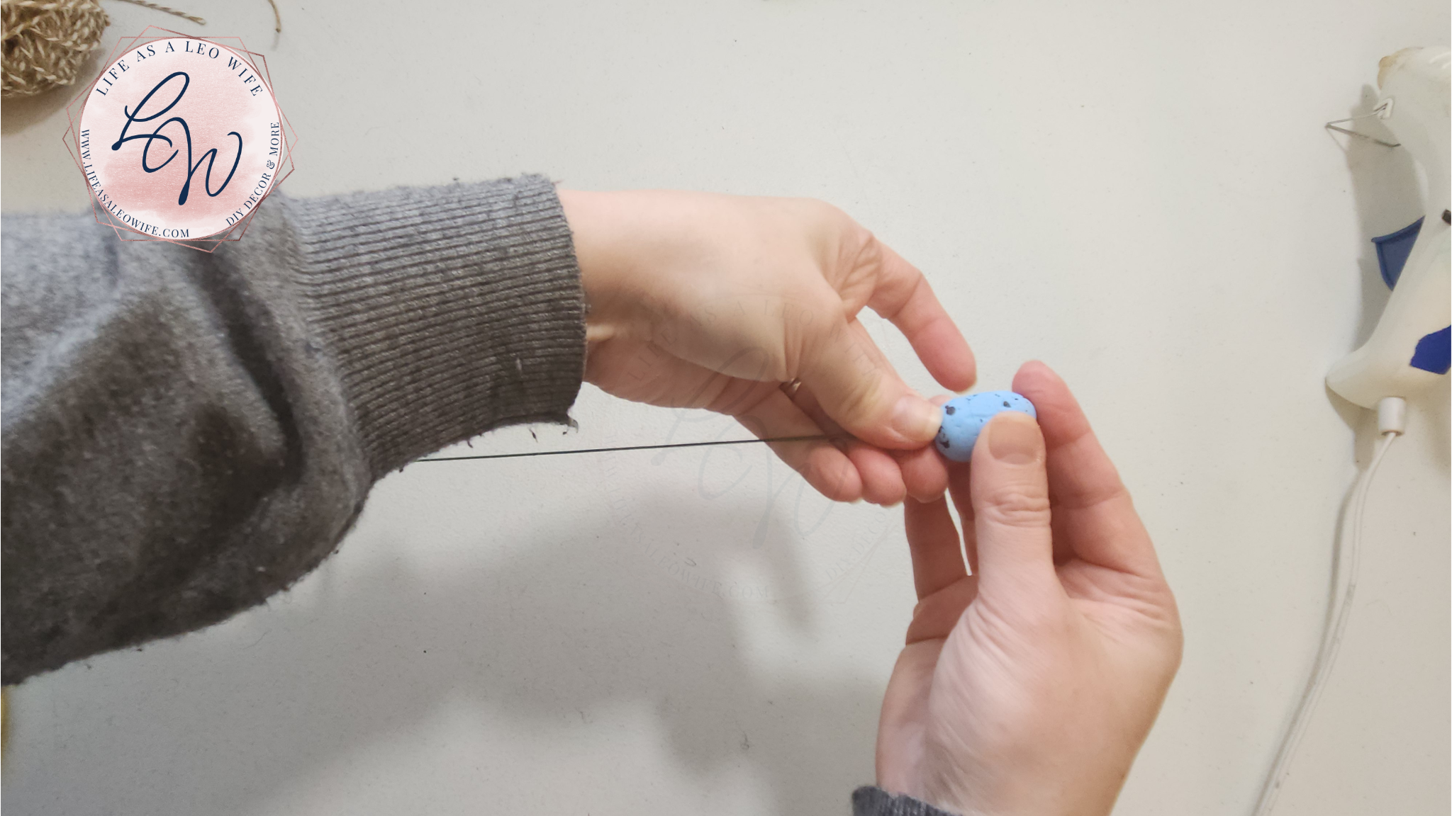 Pushing the wire through the center of a 1" styrofoam Easter egg.