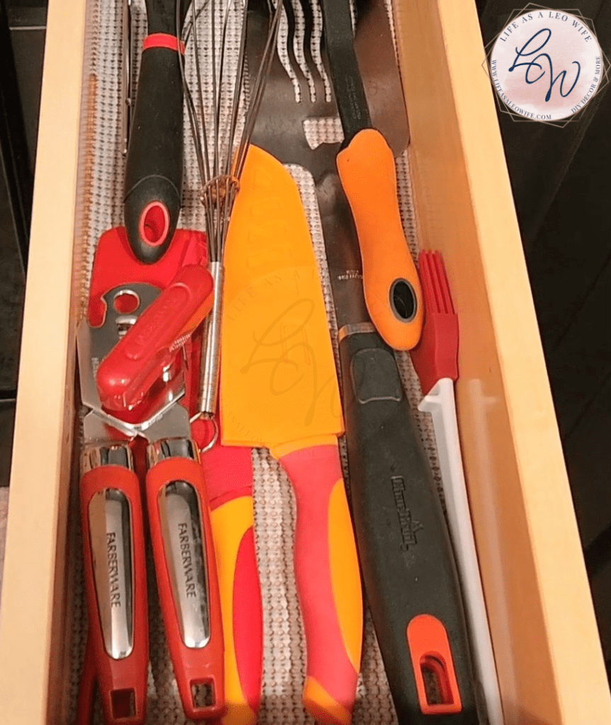 Drawer full of organized cooking utensils.