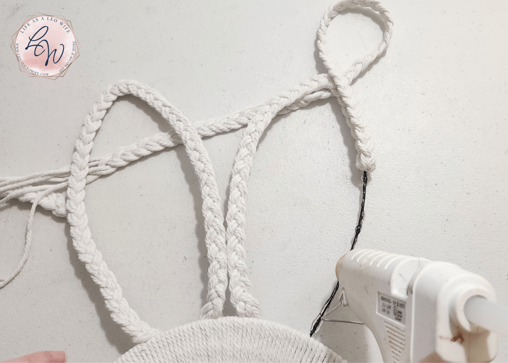 Putting hot glue on the right side of the bunny ear.