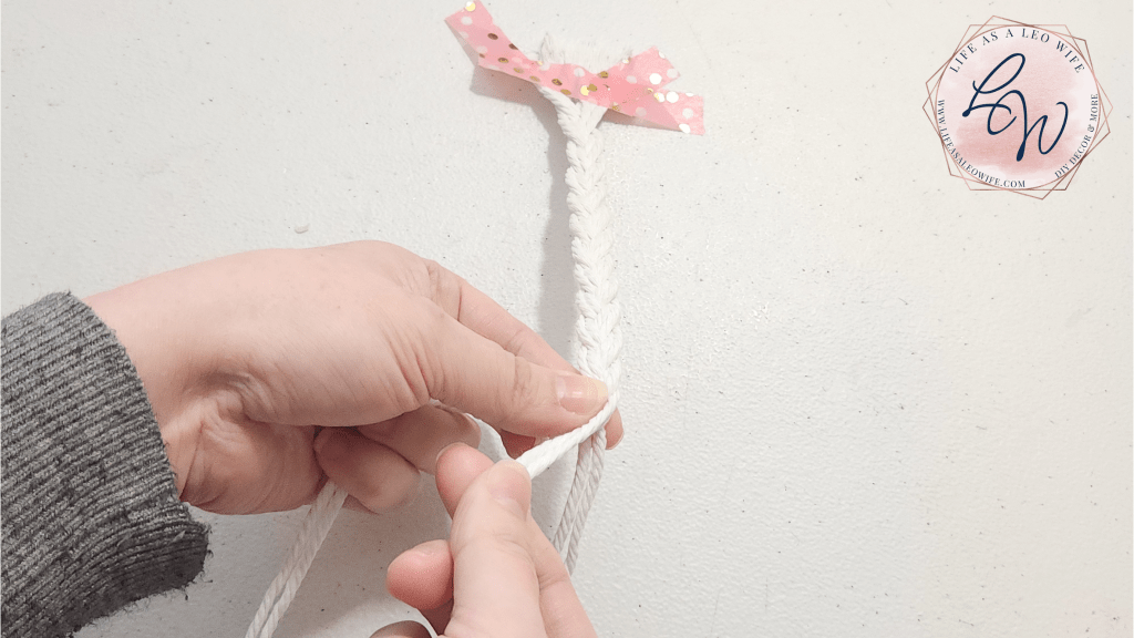 Braiding macrame cord; passing right cord over the center cord.