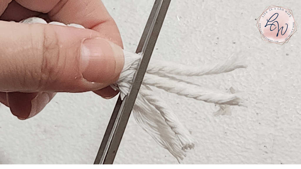 Cutting excess cord off the end of the braid.