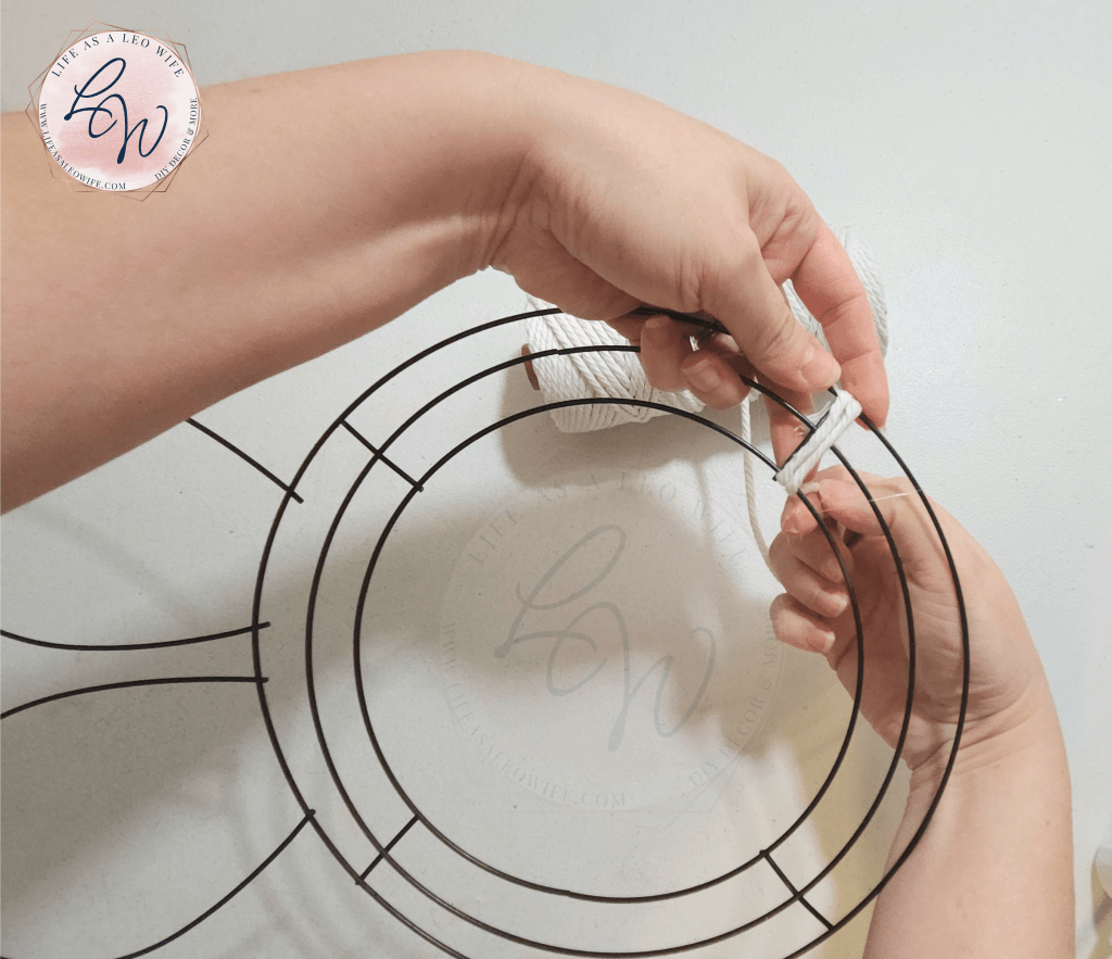 Wrapping the macrame cord around the bunny wreath form for the 2nd time.