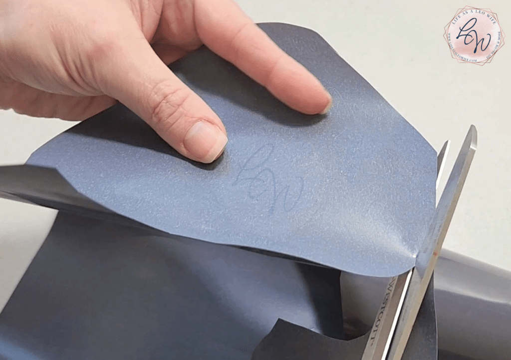 Cutting an iron on vinyl design.